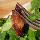 Chipotle brisket close up, hanging from fork tines